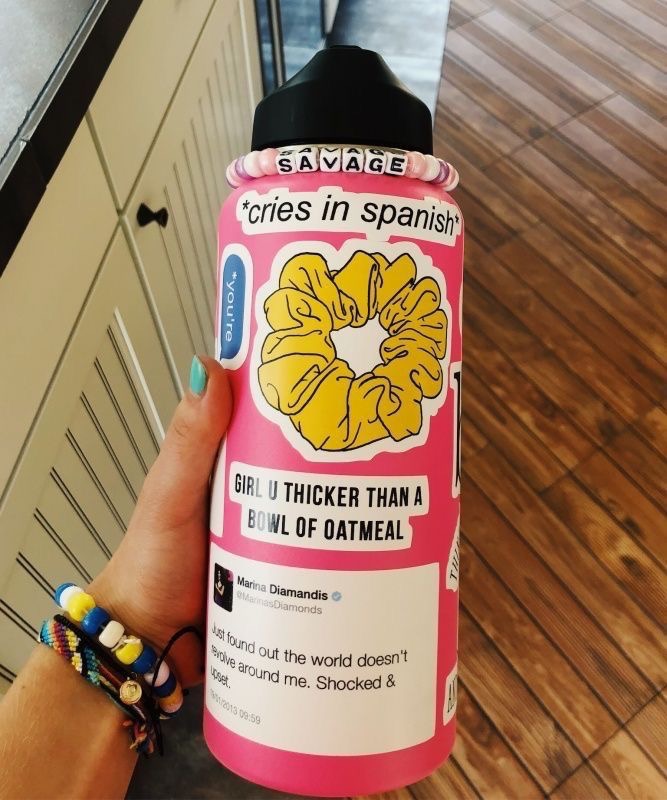 pink hydroflask with stickers
