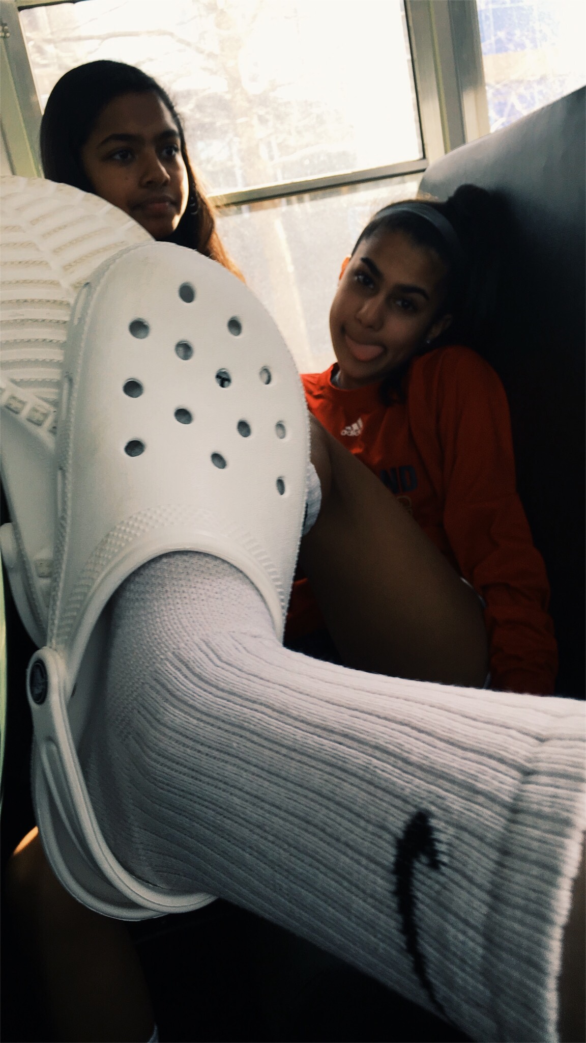 White crocs and Nike socks 